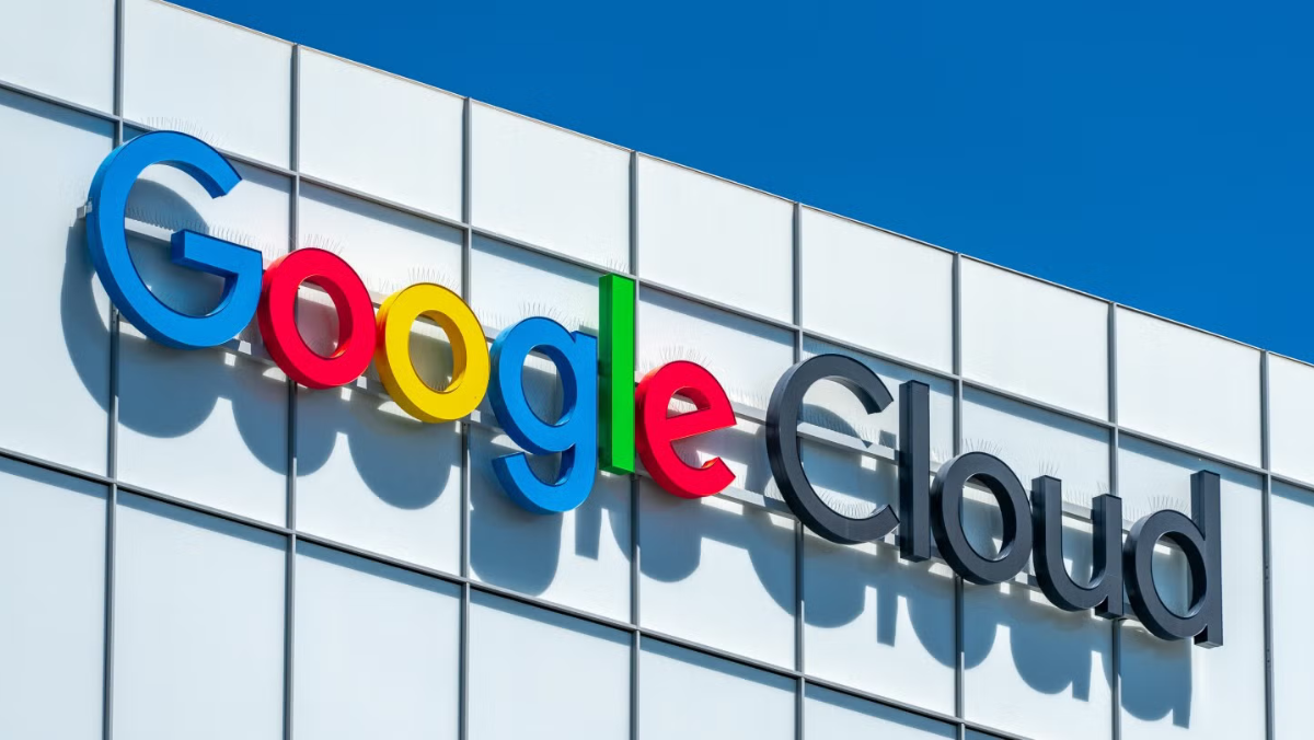 Google Cloud logo on a modern building under a clear blue sky