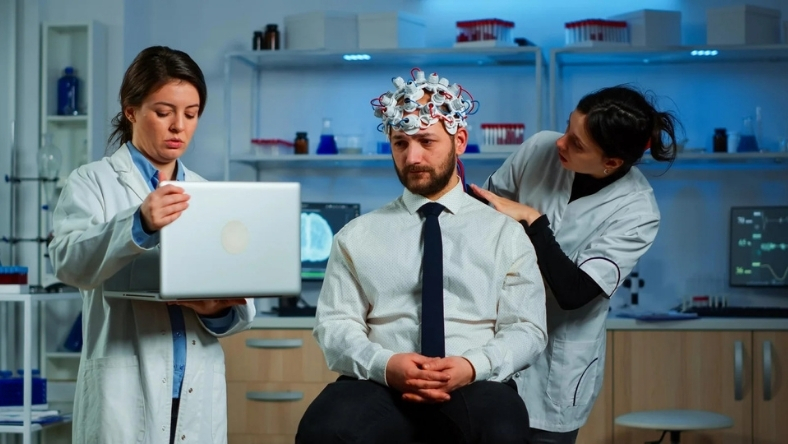 Patient undergoing brain monitoring as clinicians assess mental health treatment